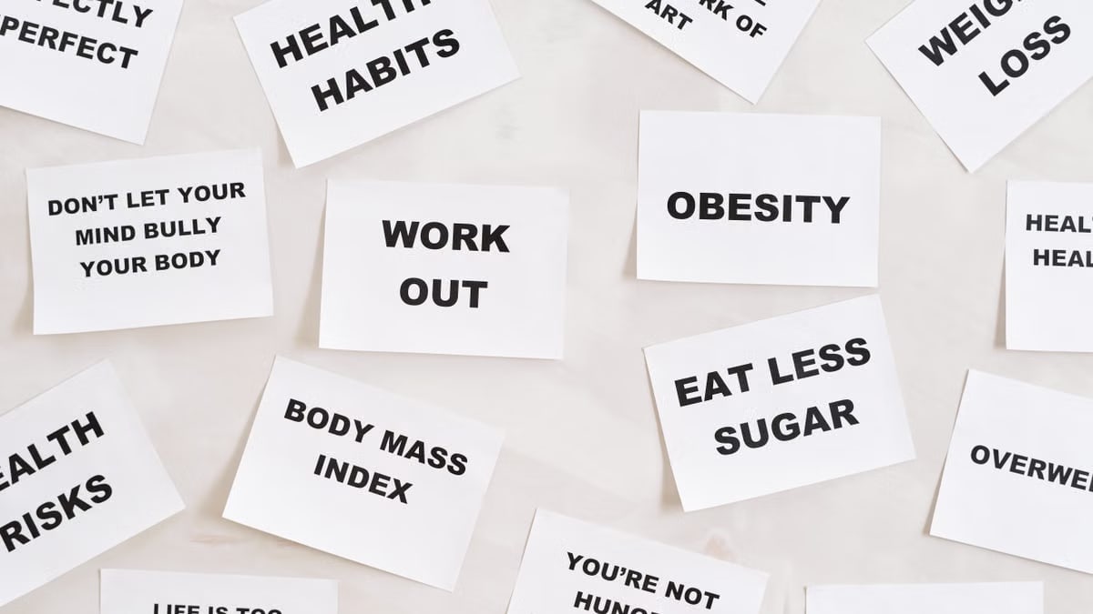Collection of motivational quotes promoting health and wellness on paper cards.